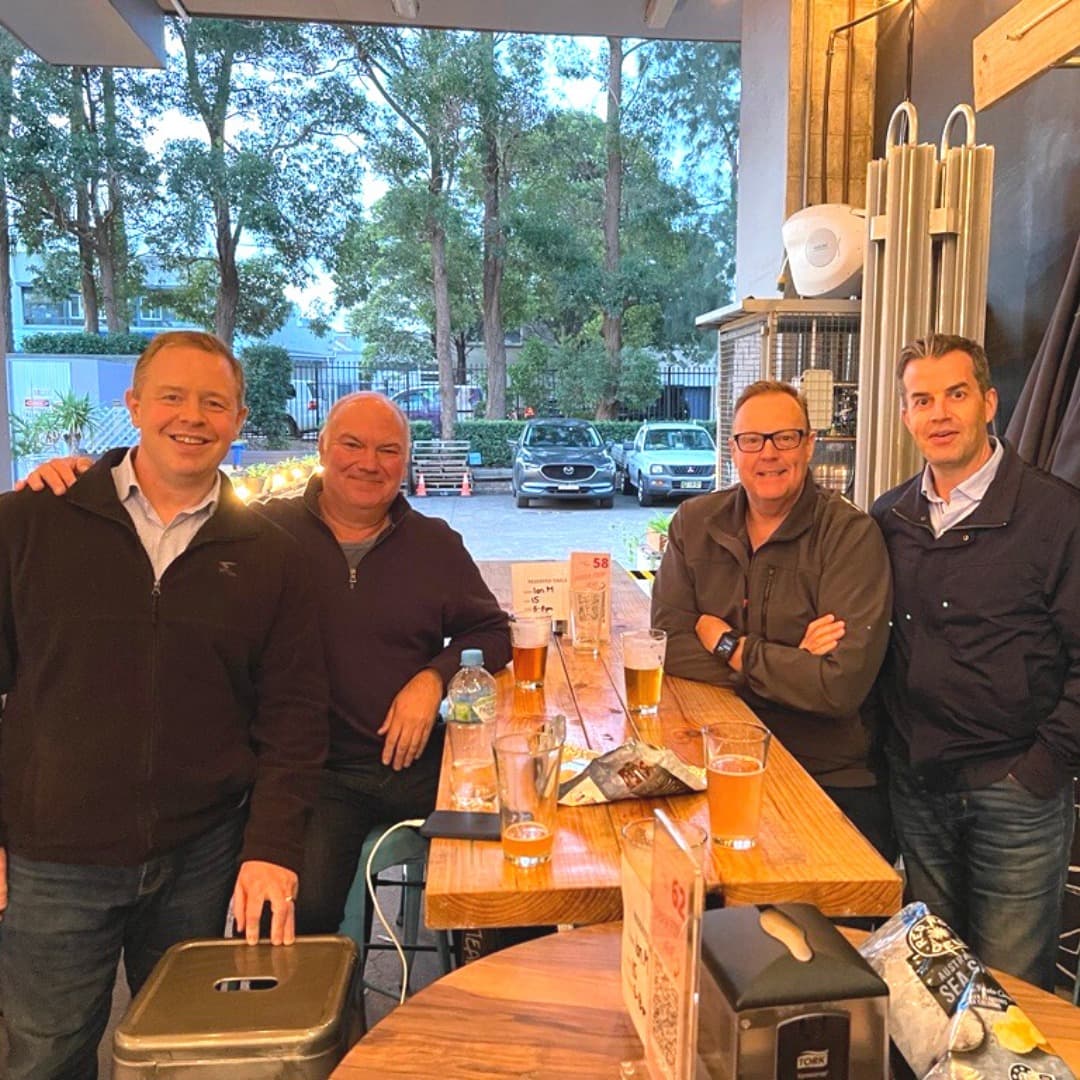Four IT services founders at a mastermind dinner in Sydney